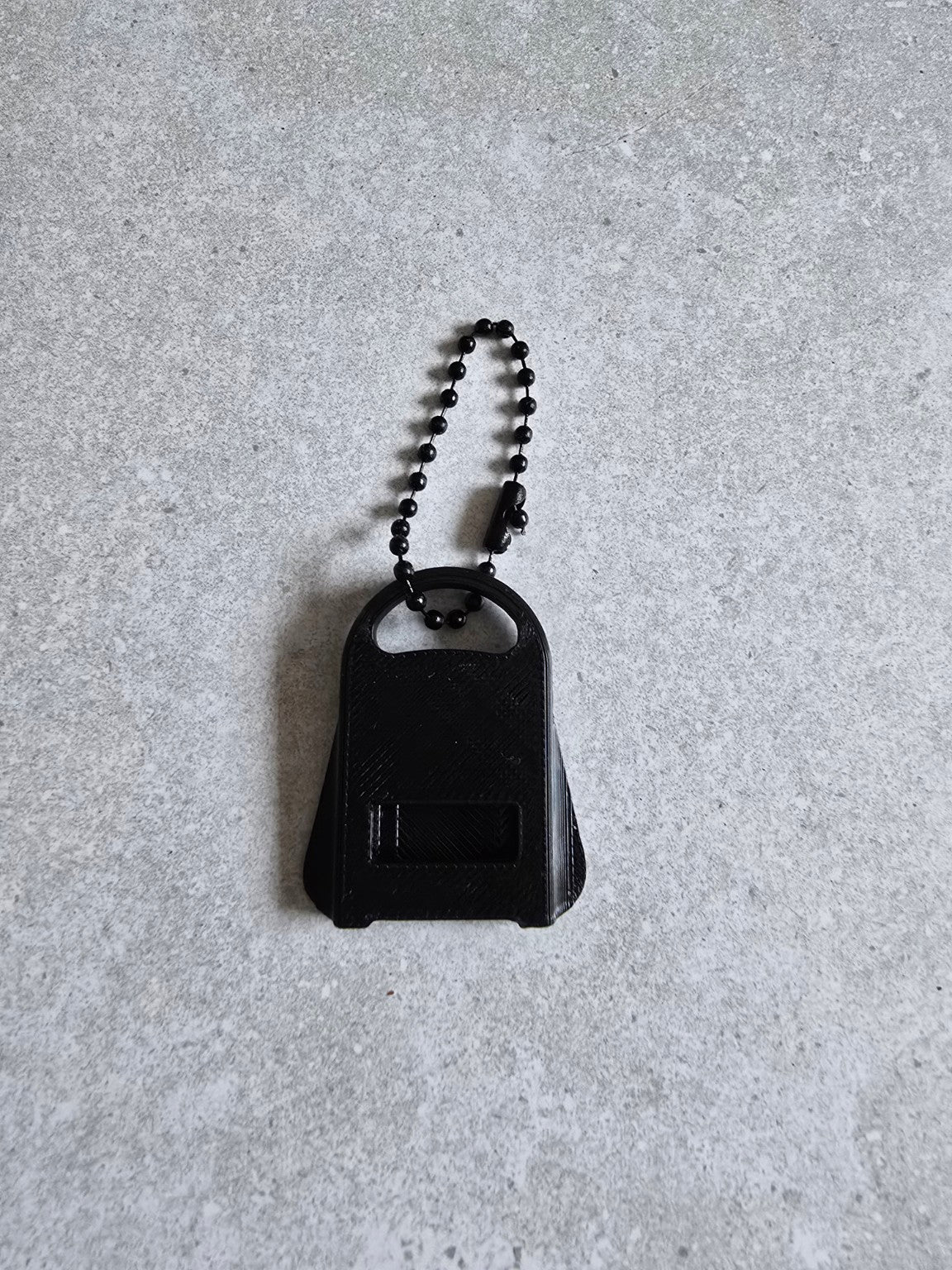 Black can tab opener keychain front view