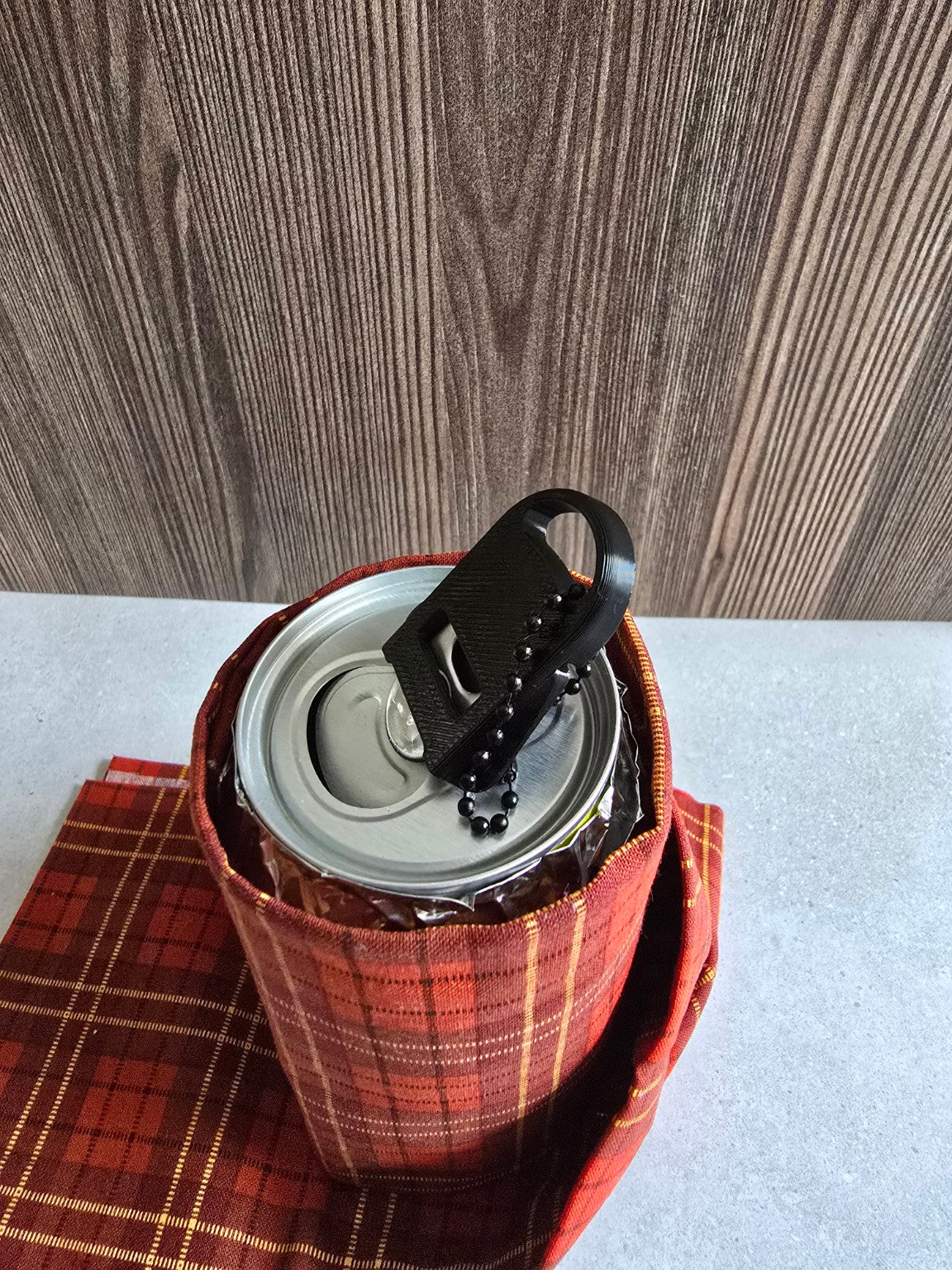 Can tab opener shown on beverage can