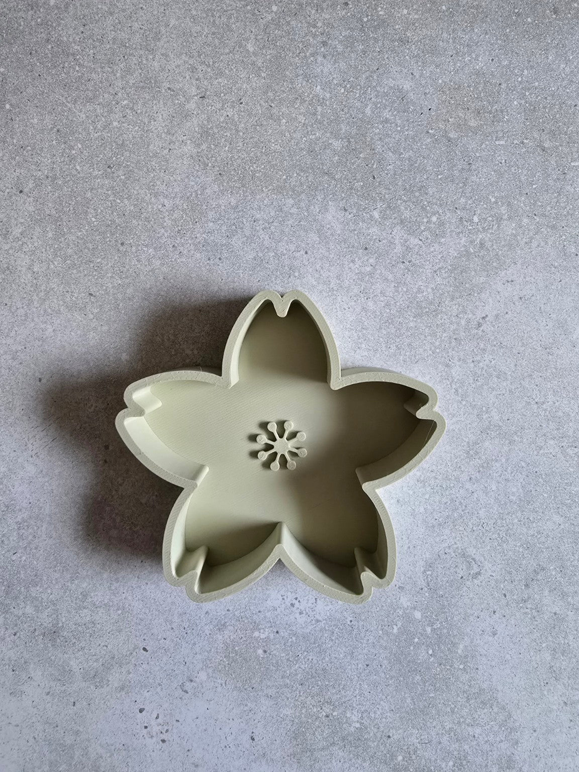 Khaki five-petal 3D printed cherry blossom trinket dish, empty.