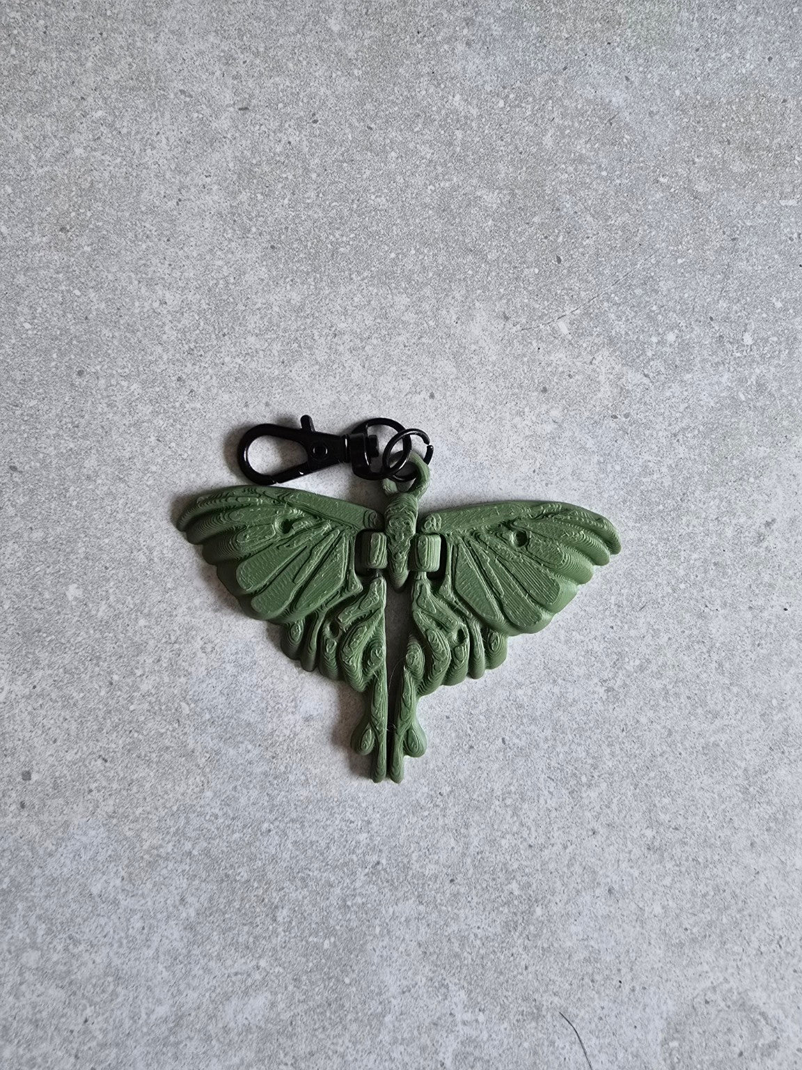Olive green moth keychain with black swivel clasp