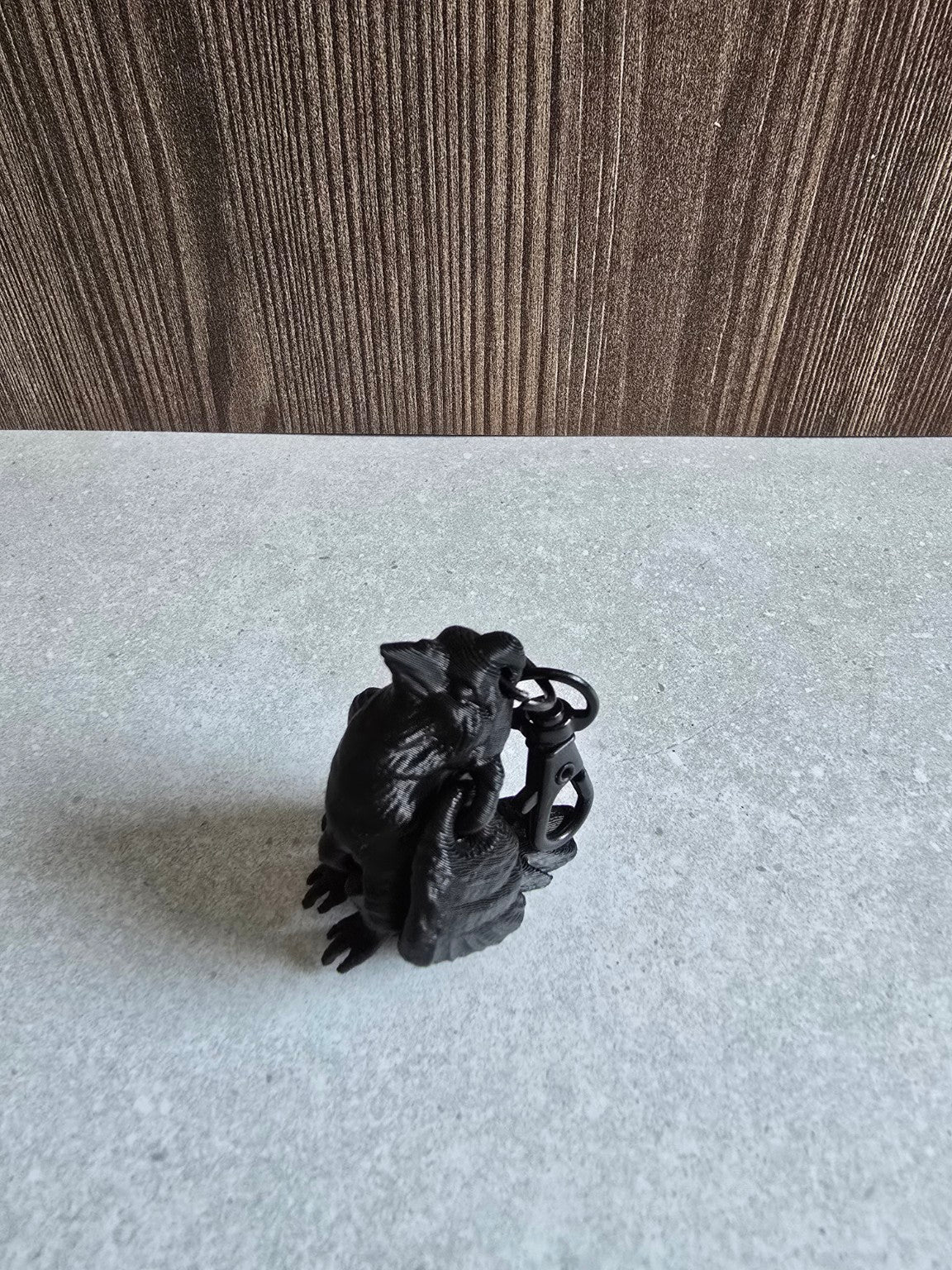 Black articulated raven keychain side view