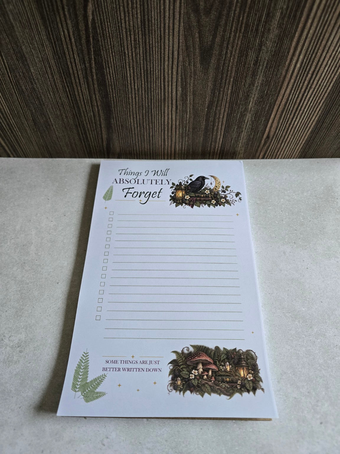 Additional perspective of half-page raven notepad on tabletop