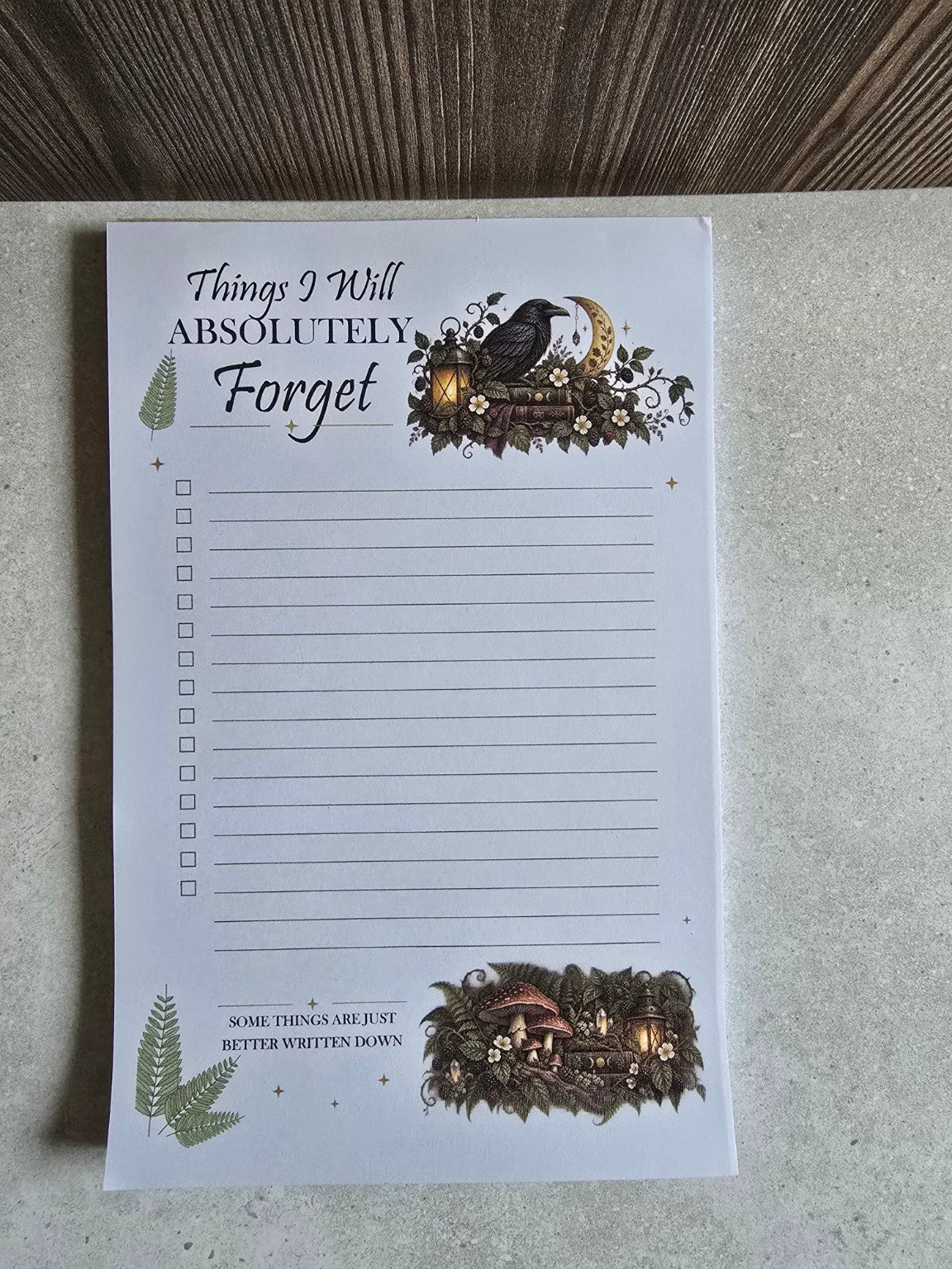 Front view of Things I Will Absolutely Forget raven checklist notepad with woodland illustrations