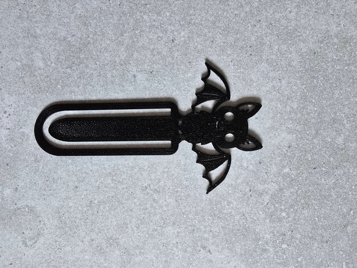 Black bat bookmark flat lay
