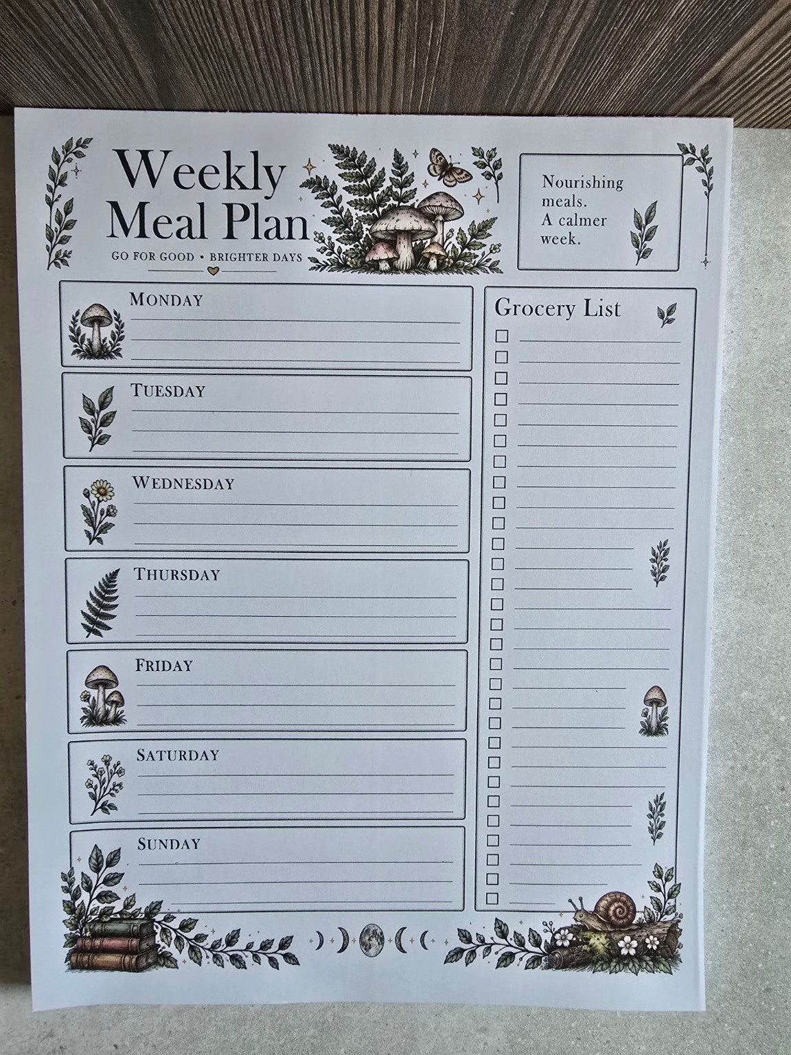 Front view of full-size Bramblefern Weekly Meal Planner notepad with seven-day meal plan, grocery list and woodland mushrooms